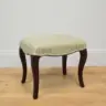 Wooden stool recovered in a woven fabric