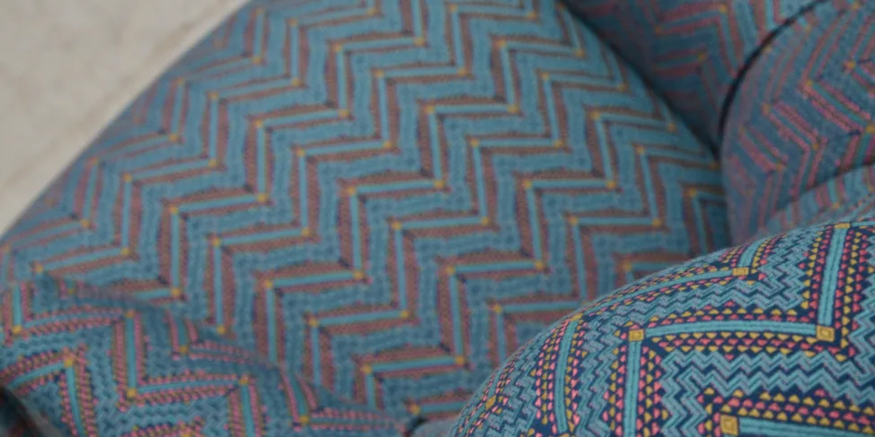 Buttoned back chair recovered