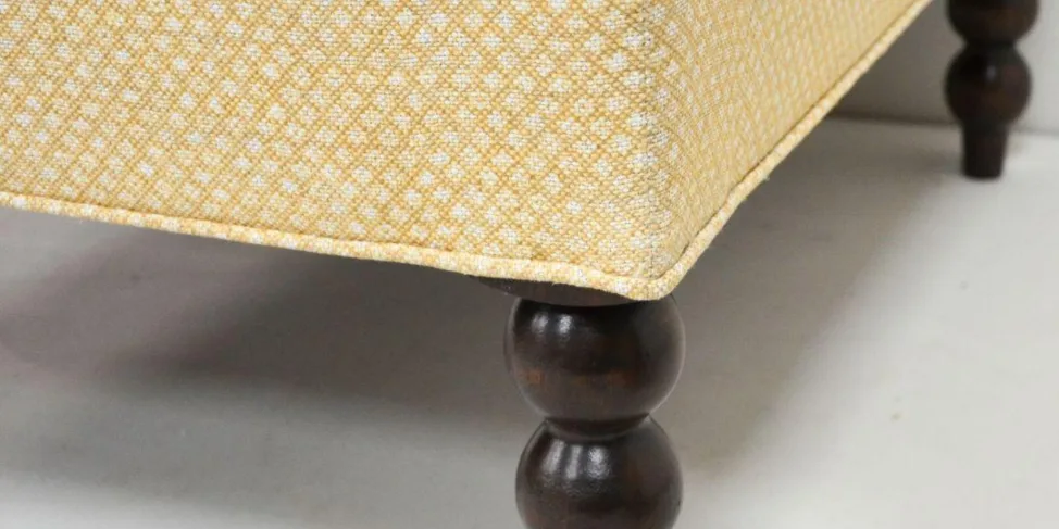 Ottoman with Carved Wooden Legs Recovered in a Printed Fabric