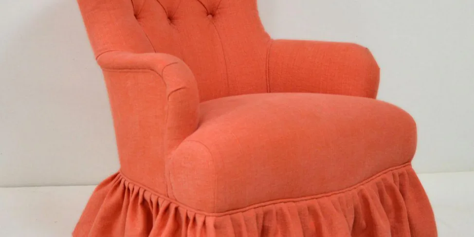 Skirted Buttonback Armchair with Curved Arms