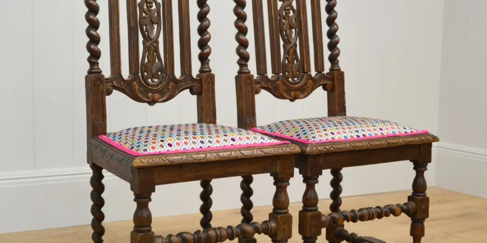 Ornate wooden chairs in an Osborne & little cut velvet and contrast trim