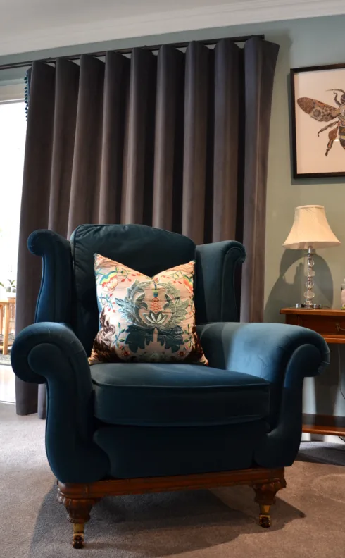 Armchair recovered with contrasting back and modified arm