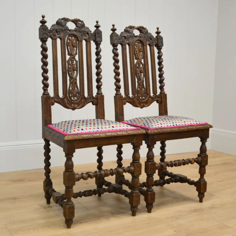Ornate wooden chairs in an Osborne & little cut velvet and contrast trim
