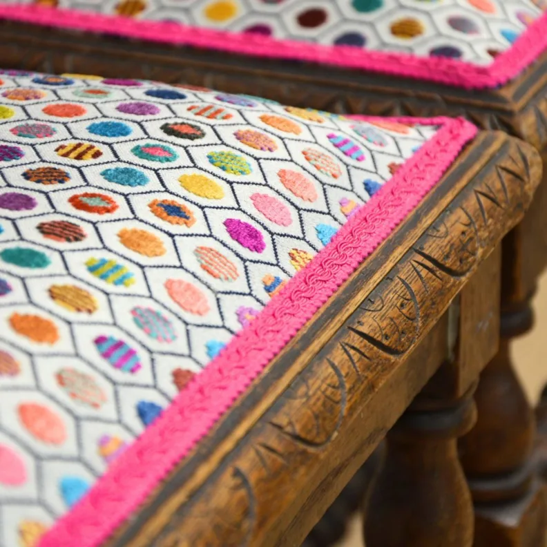 Ornate wooden chairs in an Osborne & little cut velvet and contrast trim
