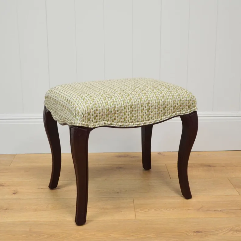Wooden stool recovered in a woven fabric