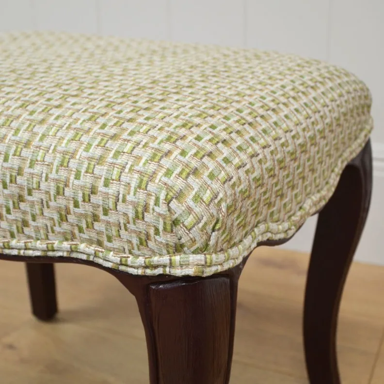 Wooden stool recovered in a woven fabric